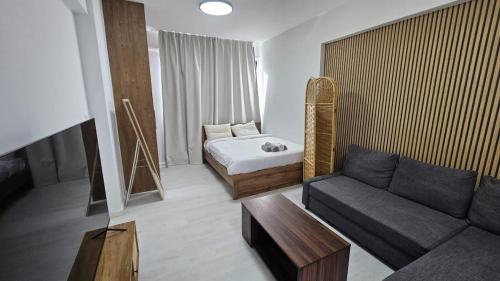 Postel nebo postele na pokoji v ubytování Antionette Studio Apartment