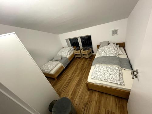 Katil atau katil-katil dalam bilik di Laichingen Center with style & tranquility