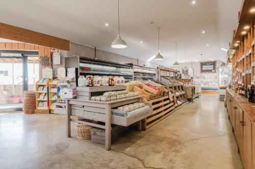 a grocery store aisle with a lot of food at Gatekeepers Cottage - Idyllic 4 Bed Rural Escape! in Cropthorne