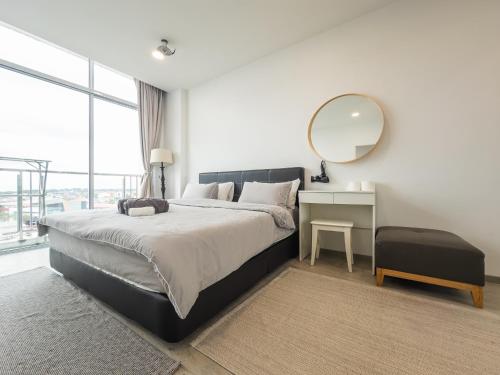 Postel nebo postele na pokoji v ubytování Stirling Homestay by Evernent