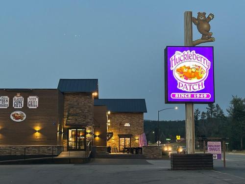 a sign in front of a building with a snack food at Hidden Gem in Hungry Horse in Hungry Horse