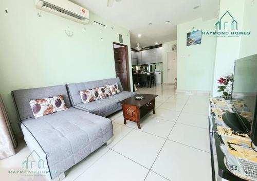 a living room with a couch and a table at Gurney Drive Mansion One Serviced Apartment in George Town