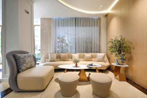 a living room with a couch and a table at Cicilia City Hotel Saigon Center in Ho Chi Minh City