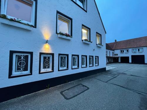 a group of windows on the side of a building at Hotel Casa Andalucia in Hallbergmoos
