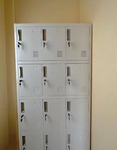 a wall with white lockers in a room at DK1Hostel in Chaweng