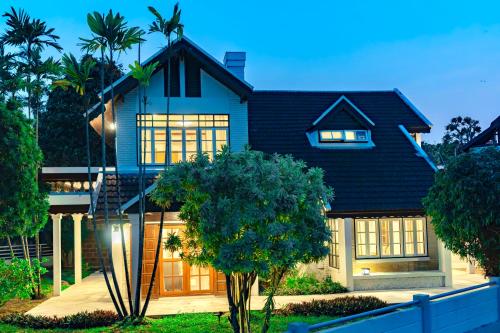 a house with a black roof at Full House Chiang Mai in Chiang Mai