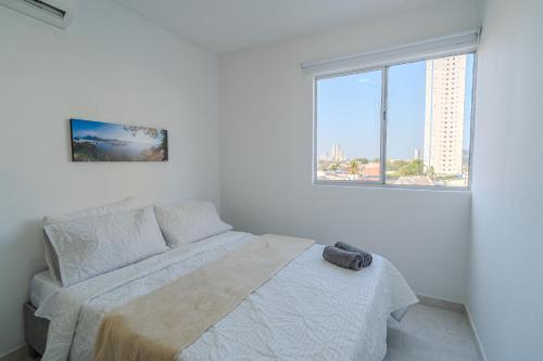 Ένα ή περισσότερα κρεβάτια σε δωμάτιο στο Apartamento de 2 habitaciones en Cartagena