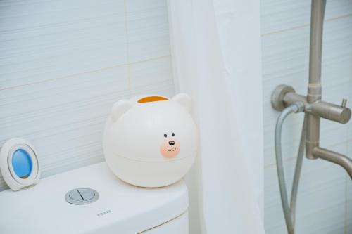 a white toilet with a hello kitty head on it at Love, Lourdes Villa in Imus