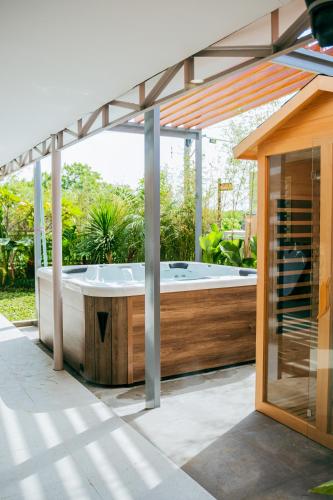 a hot tub on the patio of a house at Love, Lourdes Villa in Imus