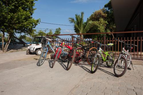 a group of bikes parked next to a fence at Le Relax Luxury Lodge in La Digue