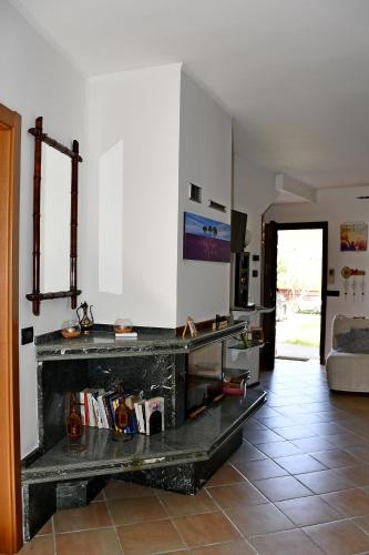 a living room with a fireplace in the middle at CASA RINA in Ventimiglia