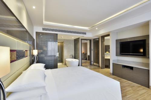 Katil atau katil-katil dalam bilik di JW Marriott Mumbai Sahar Airport