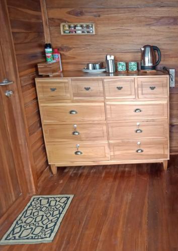 a wooden dresser with a sink on top of it at Villa Murah BOEKIT 3G dgn View 3 Gunung & Sunrise in Cikidang