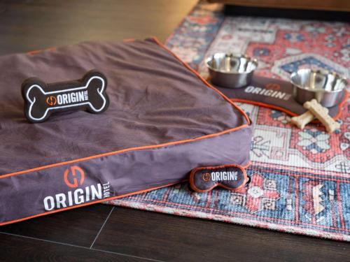 a table with two bowls and a bag on a table at Origin Kansas City Riverfront, a Wyndham Hotel in Kansas City
