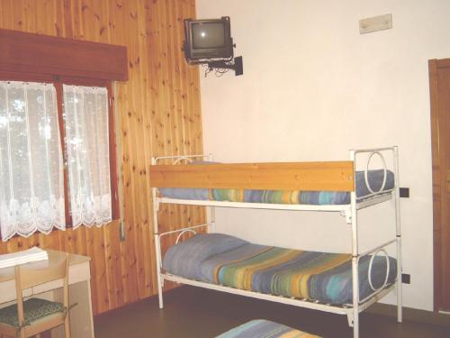 Postel nebo postele na pokoji v ubytování Albergo Tirolo