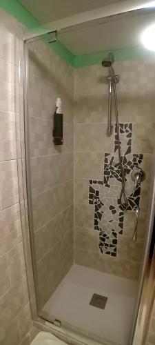 a bathroom with a shower with a toilet in it at Casa Paola in Monti