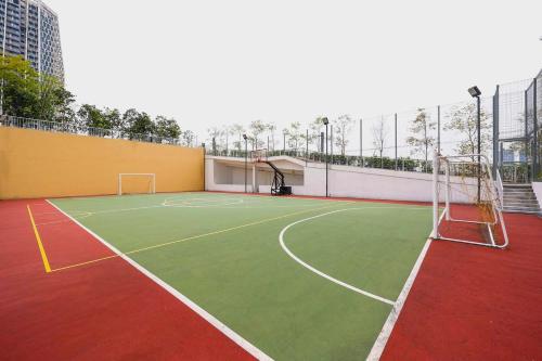a tennis court with a net on top of a building at Greenfield Residence Bandar Sunway in Petaling Jaya