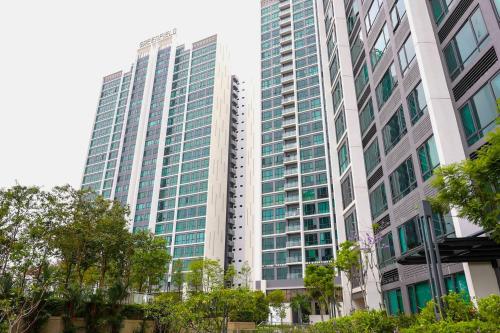 a tall building with many windows in a city at Greenfield Residence Bandar Sunway in Petaling Jaya