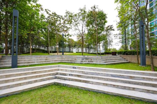 a set of stairs in a park with trees at Greenfield Residence Bandar Sunway in Petaling Jaya