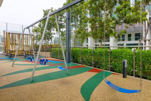 an empty playground withswing lanes in a park at Greenfield Residence Bandar Sunway in Petaling Jaya