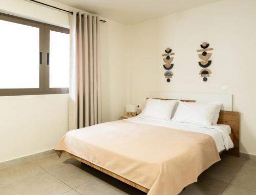 Ένα ή περισσότερα κρεβάτια σε δωμάτιο στο Elysee apartment 2
