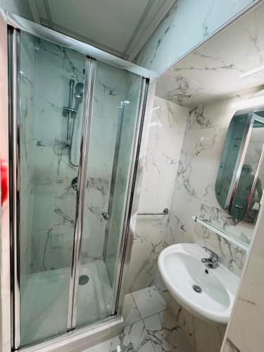 a bathroom with a shower and a sink at Casa Roma in Rome