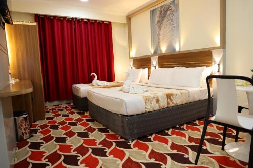Ένα ή περισσότερα κρεβάτια σε δωμάτιο στο Tanha Park Hotel