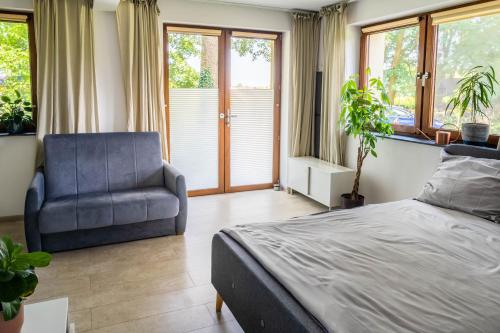 Katil atau katil-katil dalam bilik di Novinea Apartamenty