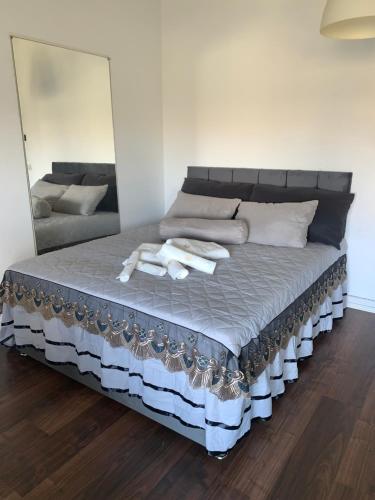 a bed with two towels on it in a room at Chic Central Stay in Luxembourg in Luxembourg
