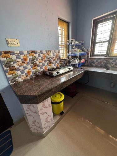 a kitchen with a counter top in a room at MOON VILLA 01 varkala 3bhk with kitchen in Varkala