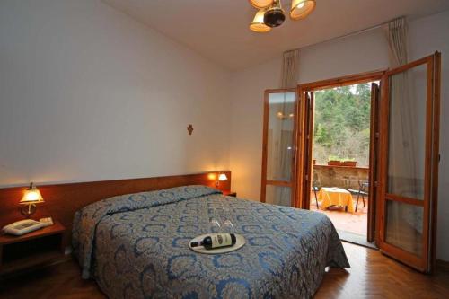 Postel nebo postele na pokoji v ubytování Hotel Archimede