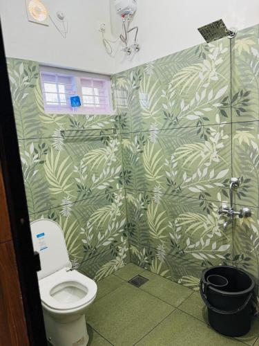 a bathroom with a shower stall with a toilet at MOON 3bhk ENTIRE VILLA 02 Varkala with kitchen in Varkala