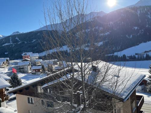a view of a town in the snow with a mountain at Casa Tresch Sedrun Tujetsch bis 5 Pers in Sedrun