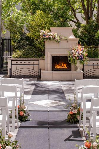 a group of white chairs and a fire place at Hyatt Regency Sacramento in Sacramento