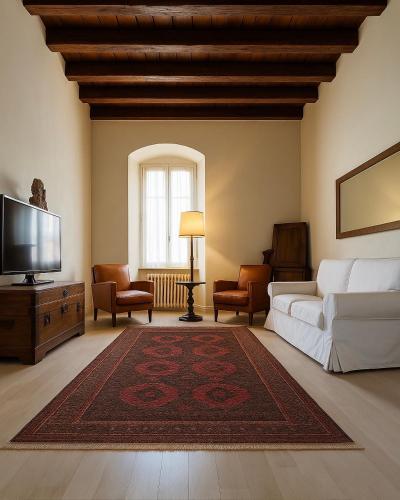 a living room with a couch and a tv at Chez Amèlie in La Spezia