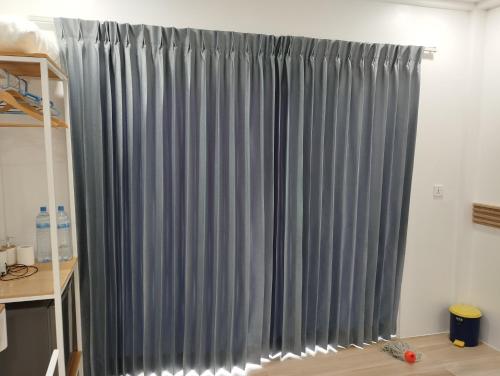 a grey curtain in a room at Himandhoo sweet dreams in Himandhoo 