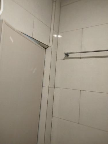 a shower stall with a door in a bathroom at Himandhoo sweet dreams in Himandhoo 
