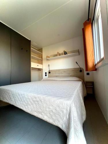 Letto o letti in una camera di Camping Village Tuscia Tirrenica