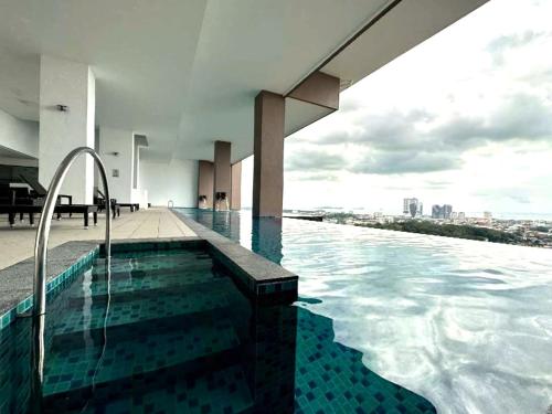 a swimming pool on the top of a building at The Apple Melaka in Melaka