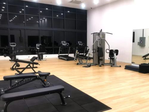 a gym with several exercise equipment in a room at The Apple Melaka in Melaka