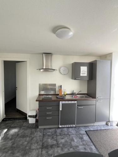 Kuchyň nebo kuchyňský kout v ubytování Familiehuis Boysen Appartementen