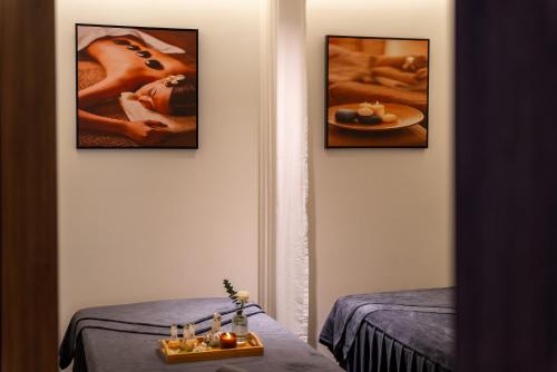 a room with three framed pictures on the wall at Cloud 22Land hotel in Hanoi