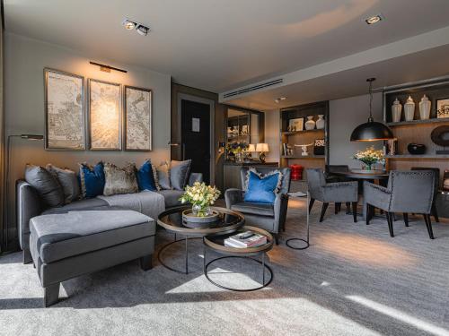 a living room with a couch and a table at Dakota Newcastle in Newcastle upon Tyne