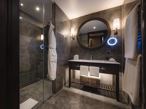 a bathroom with a sink and a mirror at Dakota Newcastle in Newcastle upon Tyne