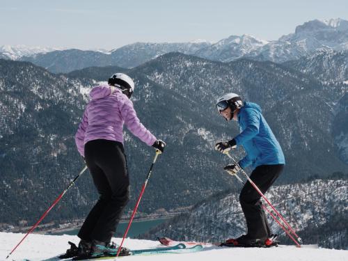 two people on skis on top of a mountain at Das Kronthaler - Adults only in Achenkirch