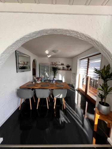 a dining room with a table and some chairs at In der Leite in Oberstdorf