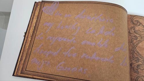 a book with purple writing on the side of it at DDM Stay 동대문 스테이 in Seoul