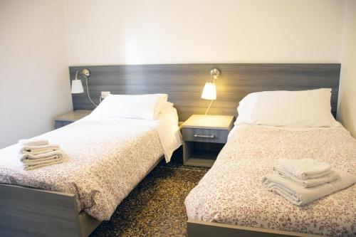 ALBERGO LOCANDA DIANAにあるベッド