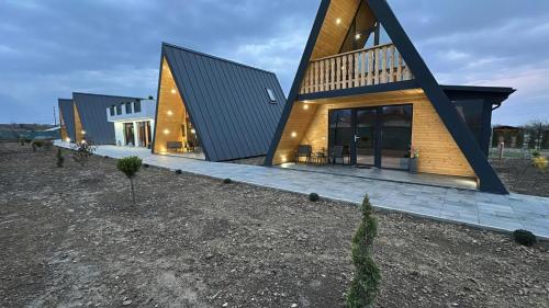 a modern house with a gambrel roof at A Frame Bâlea Chalet in Cîrţişoara