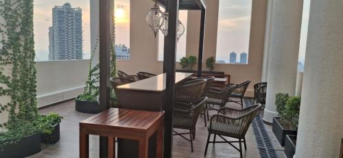 a balcony with chairs and a table on a balcony at The Anchorage Grand Colombo AT TRI-ZEN COLOMBO 02 in Colombo